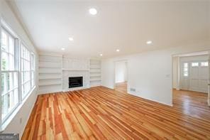 unfurnished living room with a fireplace