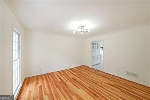 empty room with hardwood / wood-style flooring