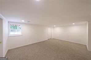 basement featuring carpet flooring