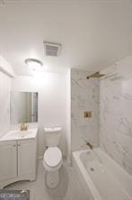 full bathroom with vanity, toilet, and tiled shower / bath