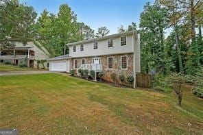 view of front facade with a front lawn and a garage