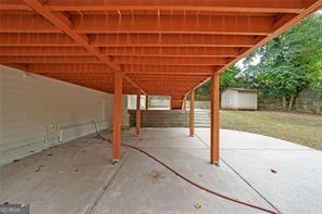 view of patio featuring a shed