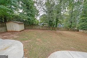 view of yard with a storage unit