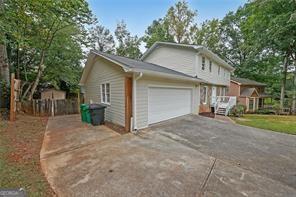 view of property exterior featuring a garage