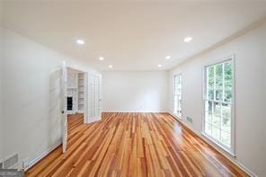 unfurnished living room featuring light hardwood / wood-style floors