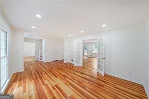 empty room featuring light hardwood / wood-style floors and a wealth of natural light