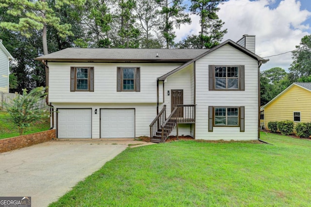 split foyer home featuring a garage and a front yard