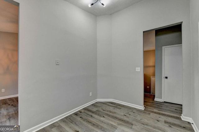 unfurnished room featuring light hardwood / wood-style floors