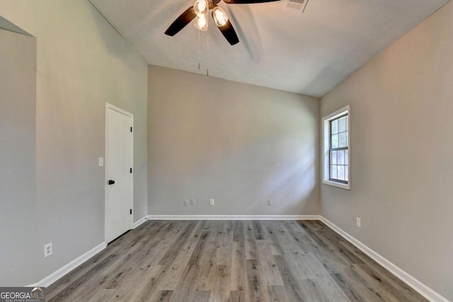 unfurnished room with ceiling fan and light wood-type flooring