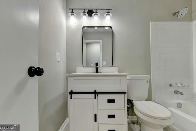 full bathroom featuring vanity, tiled shower / bath combo, and toilet