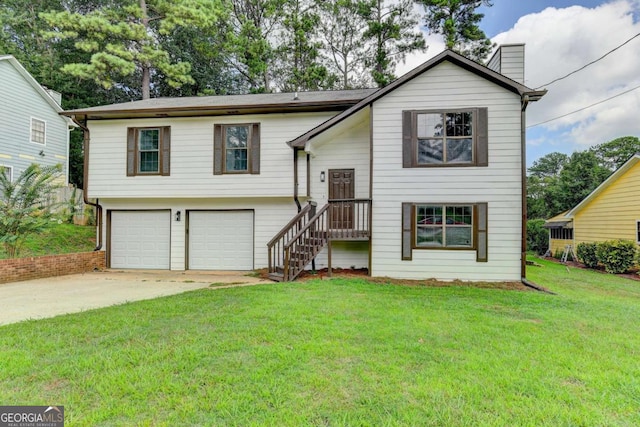 bi-level home featuring a front yard and a garage