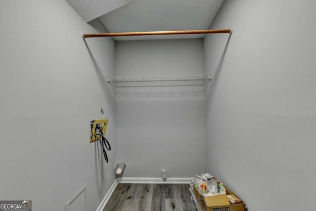 washroom featuring washer hookup and hardwood / wood-style flooring