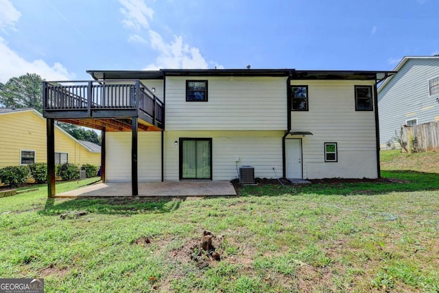 back of property featuring a patio, cooling unit, and a lawn