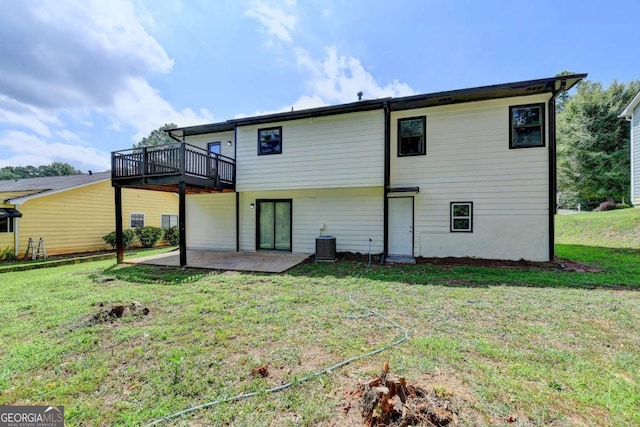 back of house with a yard, cooling unit, a patio, and a deck