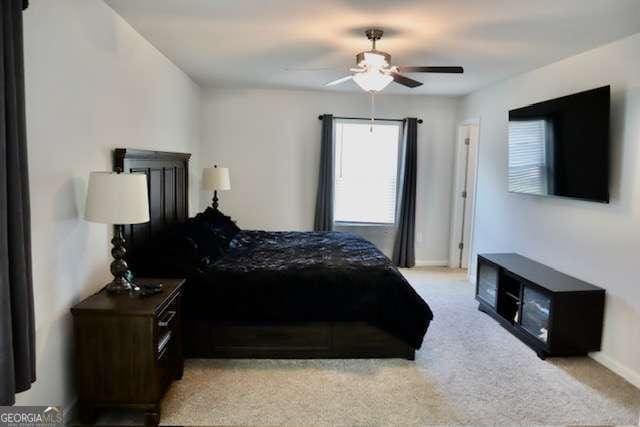 carpeted bedroom featuring ceiling fan