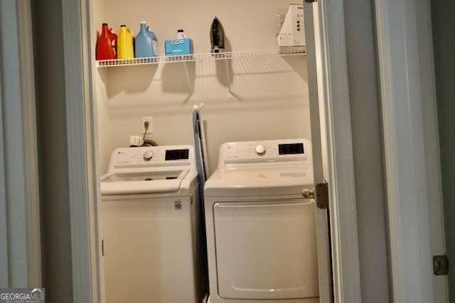 washroom featuring washer and dryer