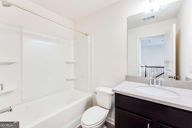 full bathroom featuring shower / tub combination, vanity, and toilet