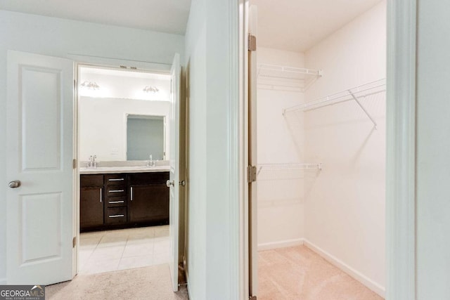 interior space with tile patterned flooring and vanity