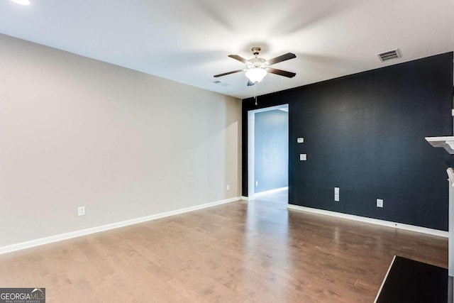 unfurnished room featuring ceiling fan and light hardwood / wood-style floors