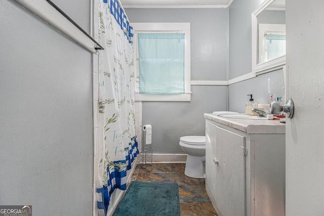 bathroom with a shower with curtain, vanity, and toilet