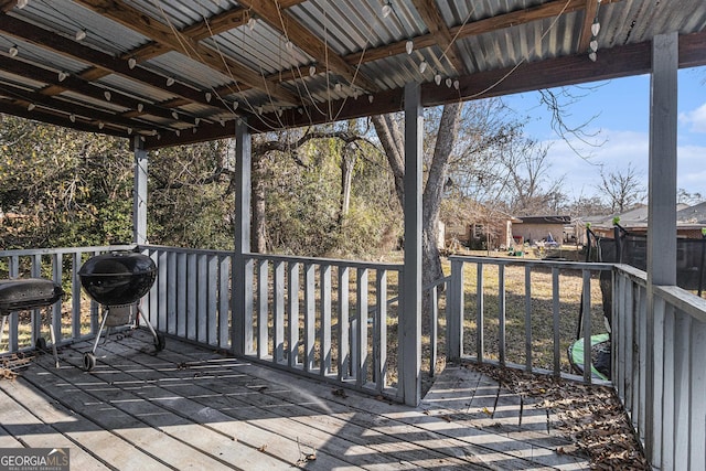 wooden deck featuring area for grilling