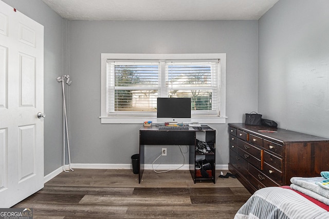 bedroom featuring dark hardwood / wood-style flooring