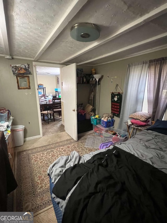 carpeted bedroom featuring a textured ceiling