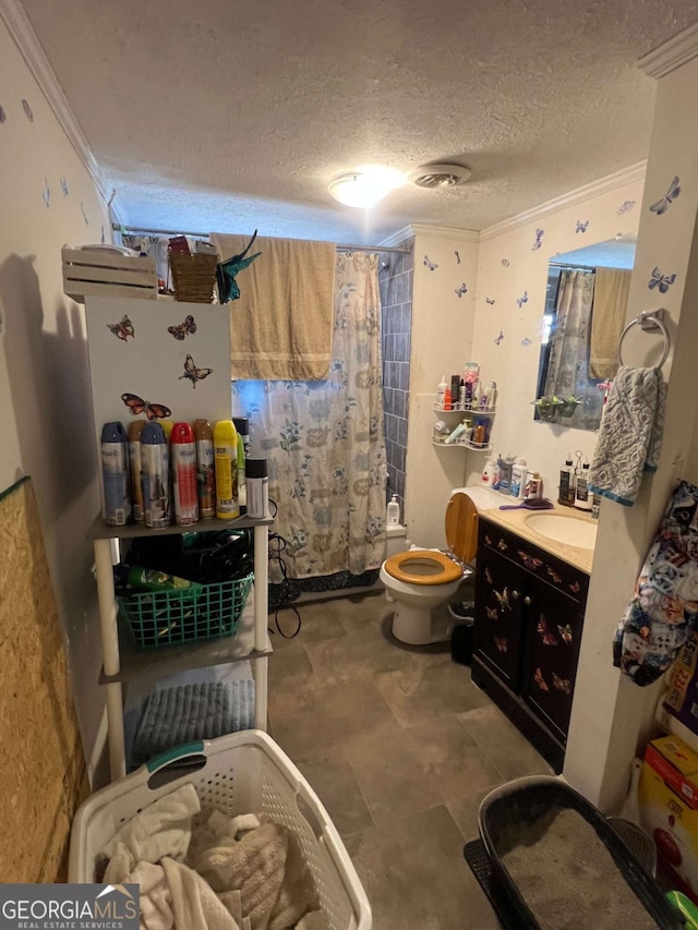 full bathroom with crown molding, a textured ceiling, toilet, shower / bath combo with shower curtain, and vanity