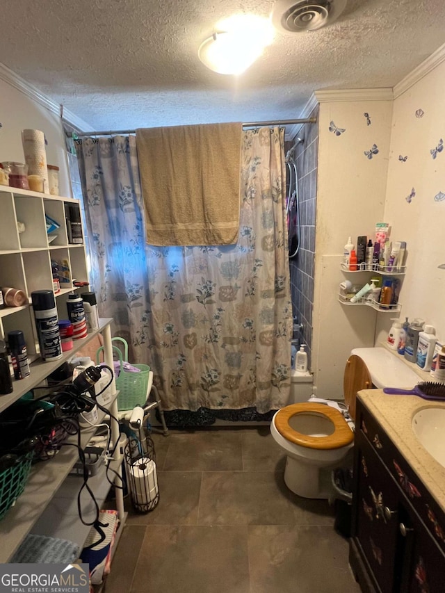 full bathroom featuring vanity, toilet, ornamental molding, and a textured ceiling