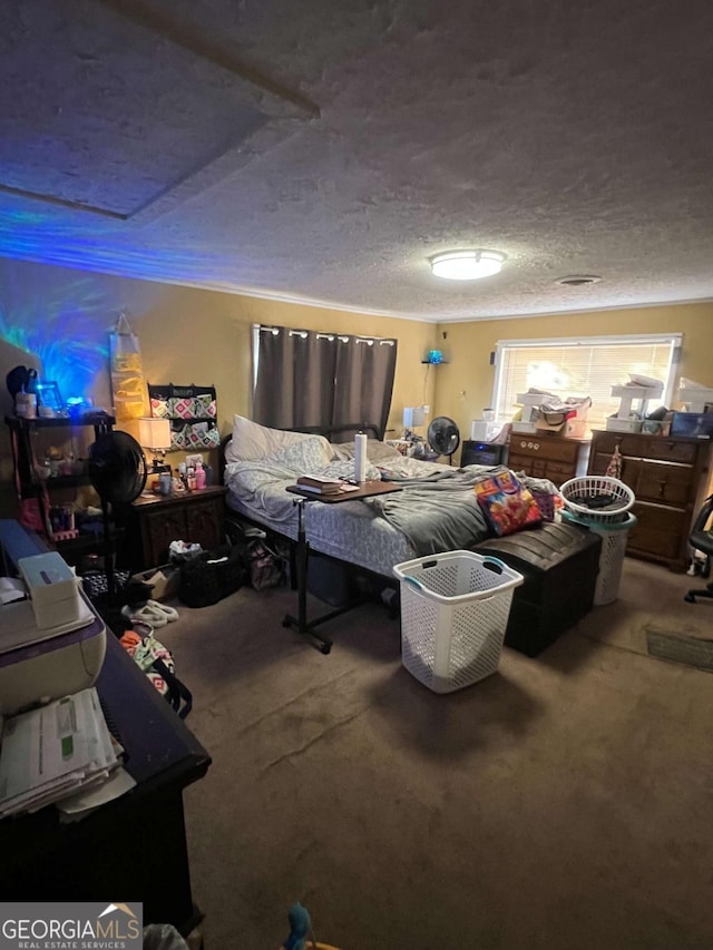 carpeted bedroom featuring a textured ceiling