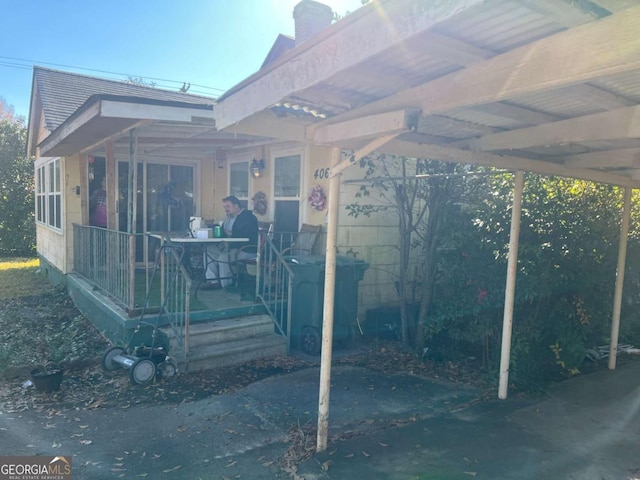 exterior space with a carport