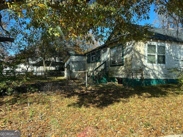 view of home's exterior featuring a yard