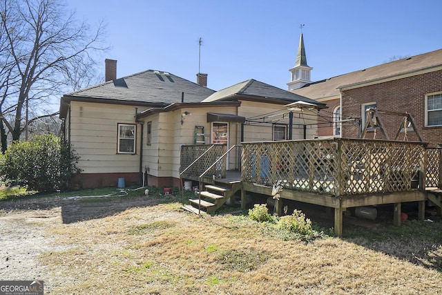 back of house featuring a deck and a gazebo