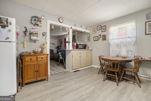 kitchen featuring light wood-type flooring and white refrigerator