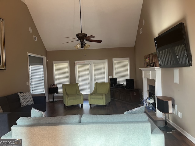 living room featuring lofted ceiling, ceiling fan, and dark hardwood / wood-style floors