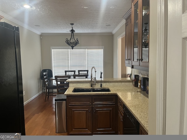 kitchen featuring kitchen peninsula, a textured ceiling, black appliances, and sink