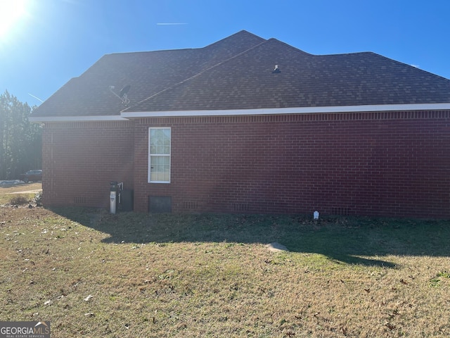 view of home's exterior with a lawn