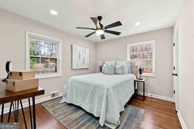 bedroom featuring ceiling fan and dark hardwood / wood-style flooring