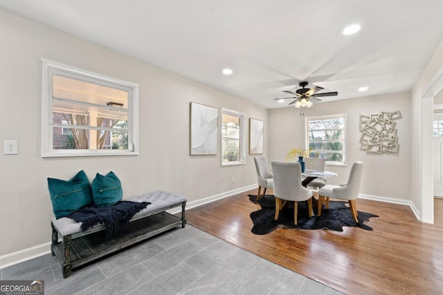 dining room with hardwood / wood-style flooring and ceiling fan