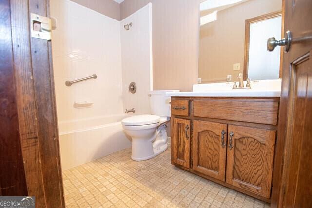 full bathroom with bathing tub / shower combination, vanity, and toilet