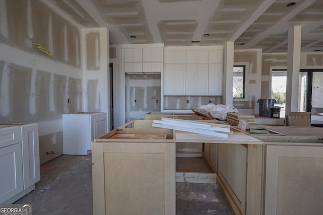 kitchen featuring a center island and white cabinets