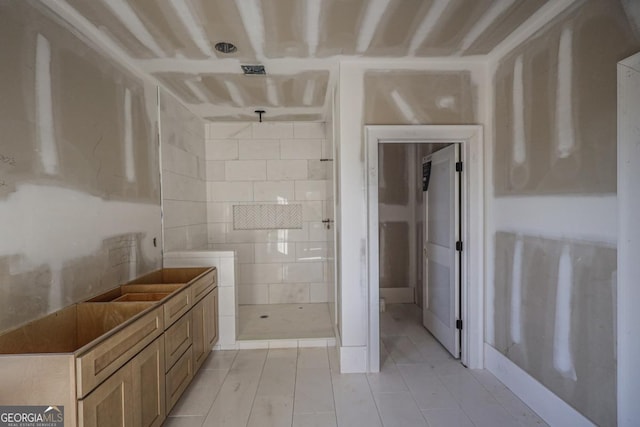 bathroom featuring walk in shower