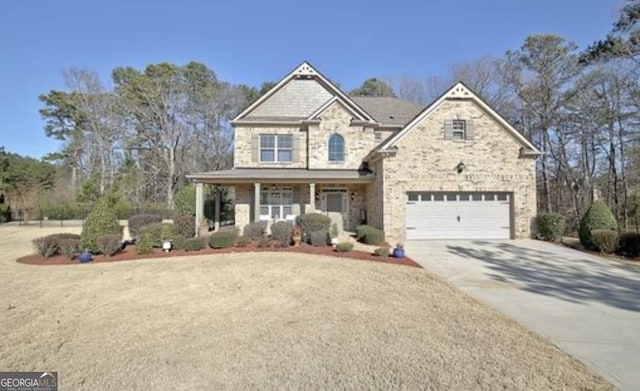 view of front of house featuring a garage and covered porch