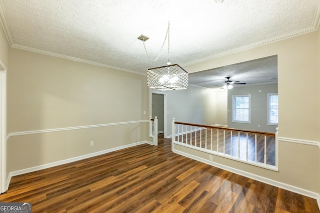 unfurnished room featuring wood-type flooring, a textured ceiling, ceiling fan, and crown molding