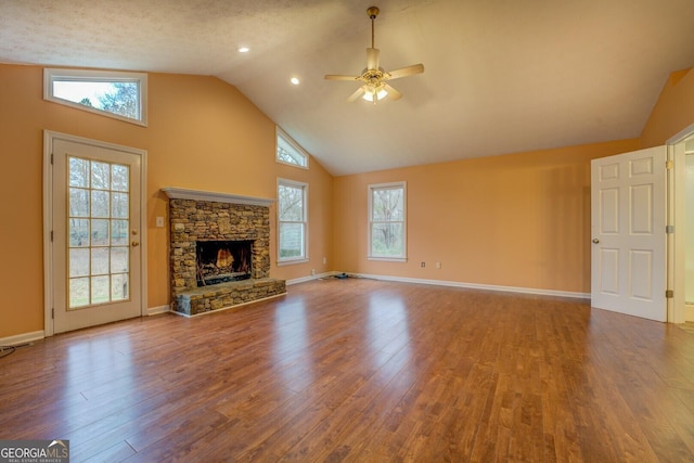 12178 Brown Bridge Rd, Covington, GA 30016 - unfurnished living room with a ceiling fan, wood finished floors, high vaulted ceiling, and a fireplace