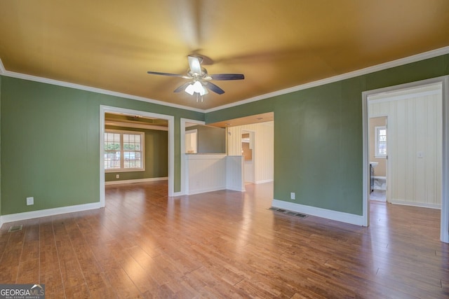 12178 Brown Bridge Rd, Covington, GA 30016 - spare room with a ceiling fan, wood finished floors, and ornamental molding