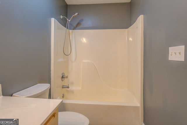 full bathroom featuring toilet, tub / shower combination, and a textured ceiling