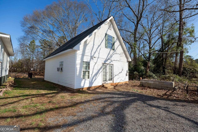 12178 Brown Bridge Rd, Covington, GA 30016 - view of property exterior with cooling unit and french doors