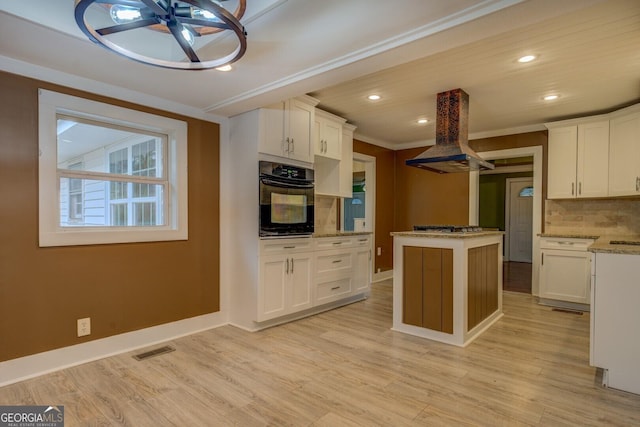 12178 Brown Bridge Rd, Covington, GA 30016 - kitchen featuring oven, island exhaust hood, recessed lighting, backsplash, and a center island