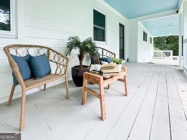 wooden terrace featuring a porch